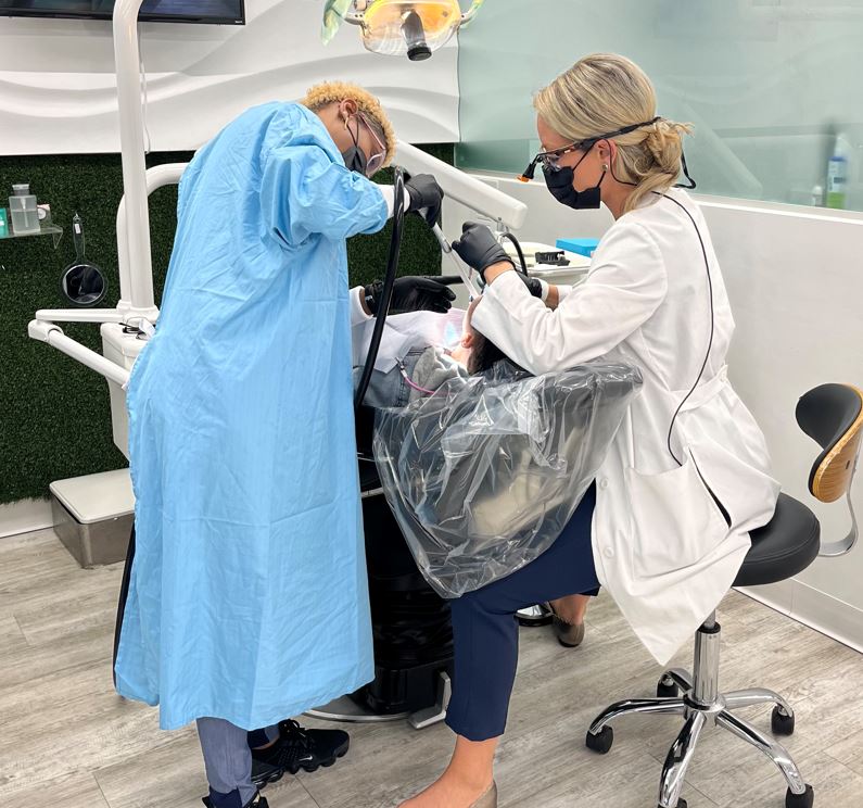 dental lounge staff doing a procedure